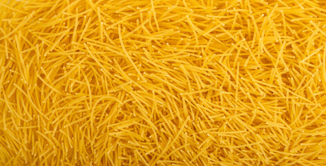 Raw vermicelli textured background, gold soup pasta pattern, small homemade noodles mock up