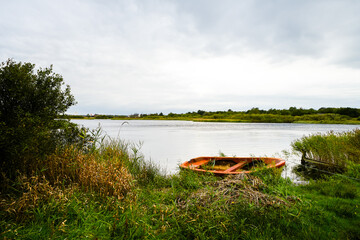 View of the pond on the Danish island of Römo near Nörre Tvismark and the surrounding landscape.

