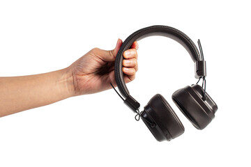 HeadPhones in hand, Headphones isolate on transparent. Wireless headphones in brown.