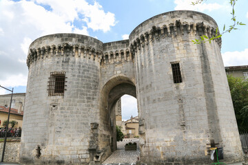 The old stone building Porte Saint-Jacques in Cognac France has a lot of detail and is very tall
