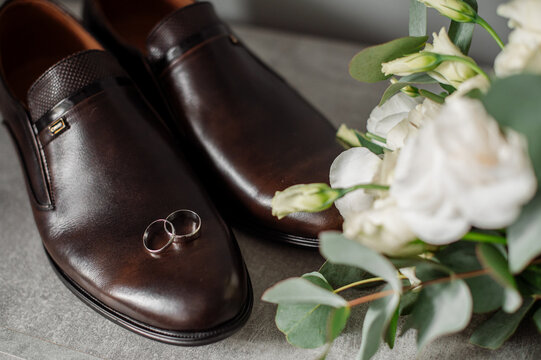 Wedding day. Bouquets and various wedding accessories, shoes, invitations, rings in the morning at the bride's preparation