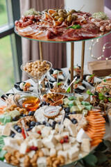 Wedding day. Buffet table with various types of snacks and sweets in the celebration hall