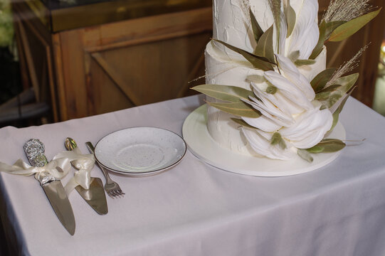 Delicate and stylish wedding cake in the celebration hall