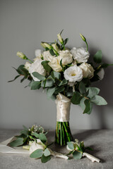 Wedding day. Bouquets and various wedding accessories, shoes, invitations, rings in the morning at the bride's preparation