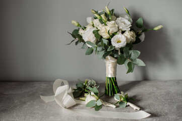Wedding day. Bouquets and various wedding accessories, shoes, invitations, rings in the morning at the bride's preparation