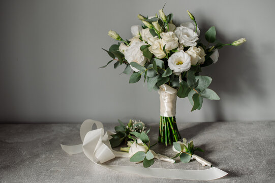 Wedding day. Bouquets and various wedding accessories, shoes, invitations, rings in the morning at the bride's preparation