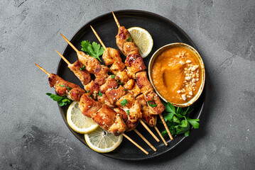 Grilled chicken satay with spicy peanut sauce