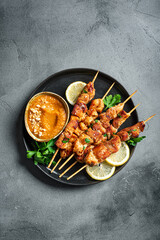 Grilled chicken satay with spicy peanut sauce