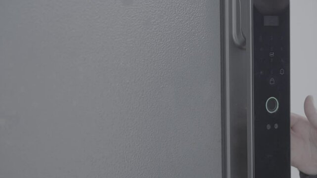Child's hand opens door with smart fingerprint lock. Slog-3