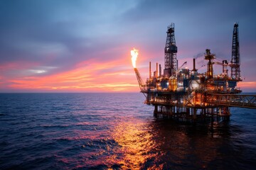 Offshore Oil Rig Platform with Gas Flare at Sunset