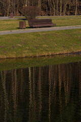 Benches for relaxing on the embankment near the lake, public places