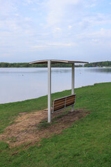 Benches for relaxing on the embankment near the lake, public places