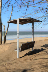 Benches for relaxing on the embankment near the lake, public places