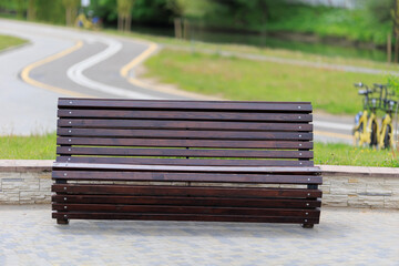 Wooden benches and chaise lounges for rest on the streets of the city and in the park, public places