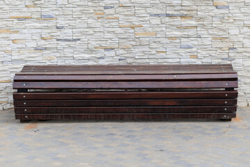 Wooden benches and chaise lounges for rest on the streets of the city and in the park, public places