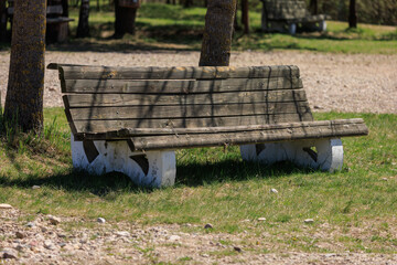 Wooden benches and chaise lounges for rest on the streets of the city and in the park, public places