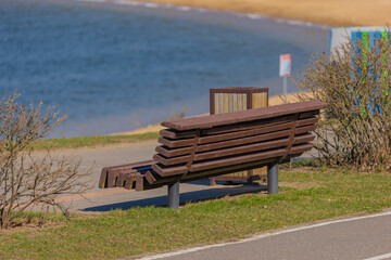 Benches for relaxing on the embankment near the lake, public places