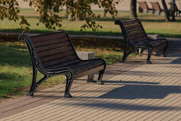 Wooden benches and chaise lounges for rest on the streets of the city and in the park, public places
