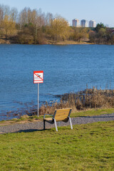 Benches for relaxing on the embankment near the lake, public places
