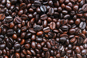 Pile of roasted coffee beans. Coffee beans background. top view