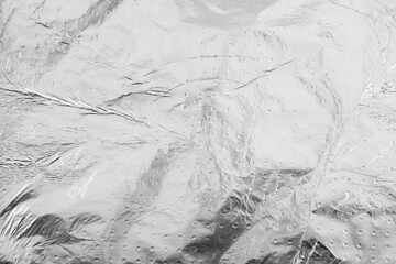 Crumpled aluminum foil as background, top view