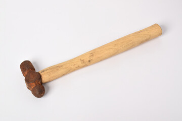 Old rusty hammer isolated on a white background