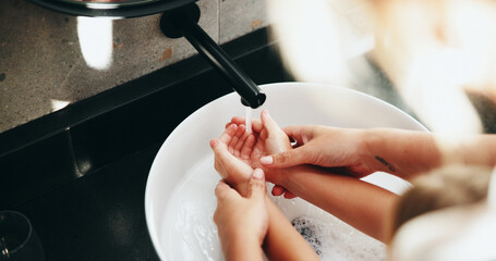 Family, tap and washing hands with water in sink for hygiene, disinfection or cleanliness at home. Parent, child and rinse with kid, faucet or basin in bathroom for bacteria or germ removal at house