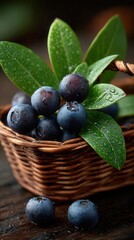 Fresh blueberries with green leaves in wicker basket