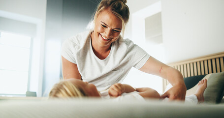Home, mother and child with tickle for playing, laughing and bonding together with happy smile....
