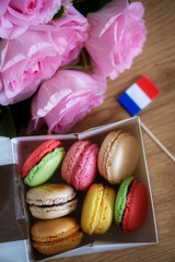 macaroons in the box and pink roses