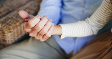 Obraz premium Holding hands, grandparent and bonding with grandchild, closeup and affection for kid in living room. Empathy, support and family with love in lounge, compassion and care elderly person in house