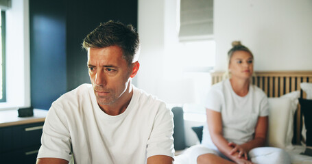 Frustrated couple, disagreement and fight in bedroom for divorce, breakup or argument at home....