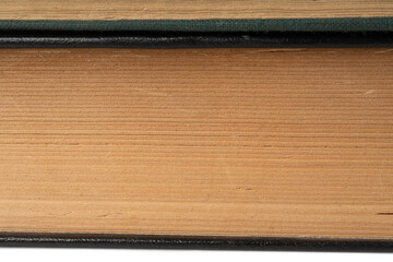Old book stack pages texture. Vintage books background, antique library collection closeup