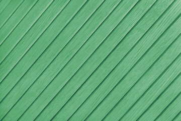 Wooden diagonal plank, bamboo surface texture, board wall background. Painted wooden panels green...