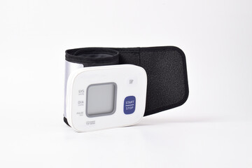 Digital wrist blood pressure monitor isolated on white background. Health care and check up concept