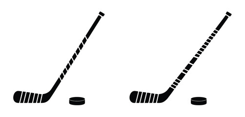 Two Hockey Sticks and Pucks Isolated on White Background