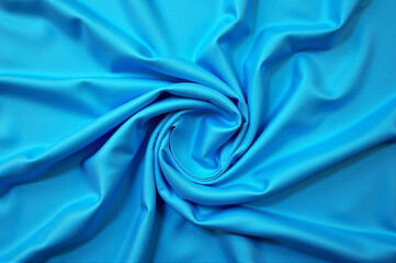 Obraz premium Close-up of a light blue fabric with a smooth and elegant texture.
