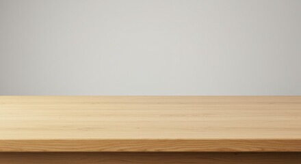Fototapeta premium Simple wooden tabletop against a neutral background, ideal for product display