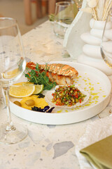 Restaurant seafood serving with lemon and sauce