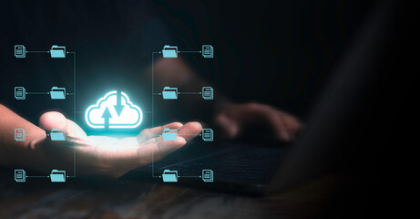 Man using laptop and showing cloud technology and data management on palm. Cloud computing concept...