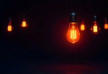 Several hanging light bulbs, only one glowing in the center, isolated on dark plain background, dramatic contrast lighting, copyspace for message or text