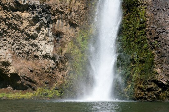 Close-up view of Hunua Falls cascading over rocky cliff - Powered by Adobe