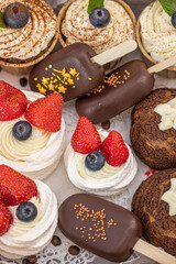 Homemade sweets made from natural and healthy ingredients. Festive background with mini cakes. Delicious cake