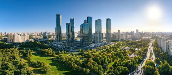 Obraz premium Moscow City Skyline: Modern Architecture Amidst Lush Greenery