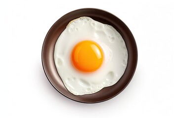 One Chicken Egg in a Small Pan Isolated, Lightly Fried Egg on White Background Top View, Flat Lay