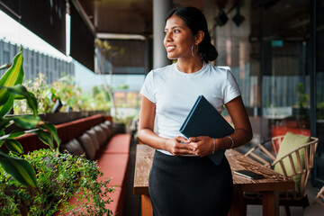 Confident and accomplished Business Professional thriving in a vibrant Modern Workspace setting
