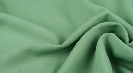 Soft green fabric draping elegantly, showcasing texture and light play