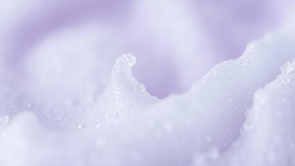 Delicate lavender foam with droplets highlighting texture and softness in a calming color scheme