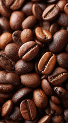 Obraz premium Scattered Roasted Coffee Beans on Textured Surface