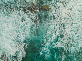 Aerial View of the Sea and Waves. The vast ocean stretches endlessly, with waves. Nature, tranquility, and adventure.	